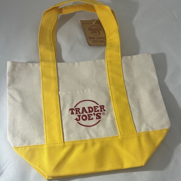 Trader Joe's Handbags - Trader Joe's Yellow and Cream Canvas Tote